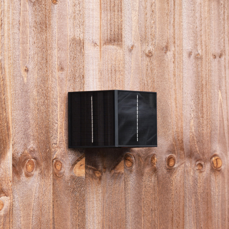 Aptrix solar wall light installed on a timber fence