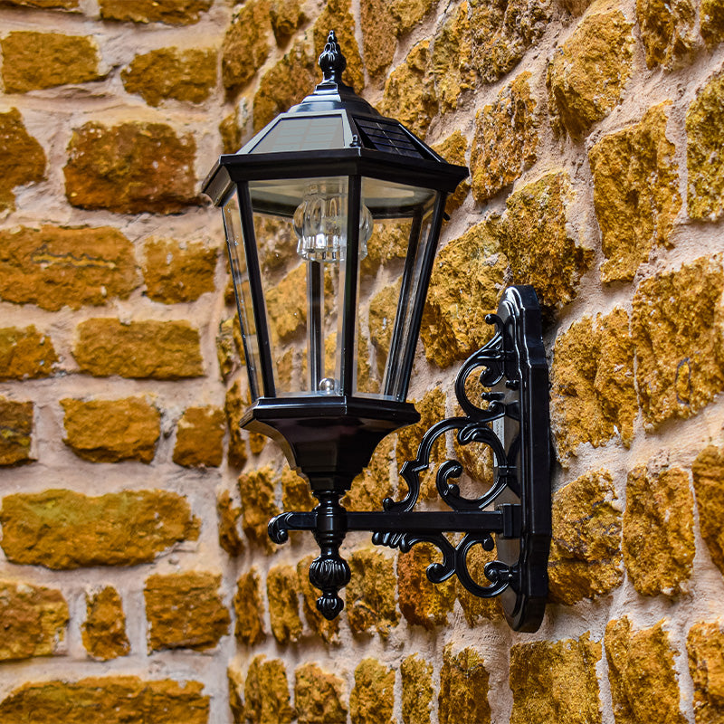 Bramwick solar wall light installed on a stone property