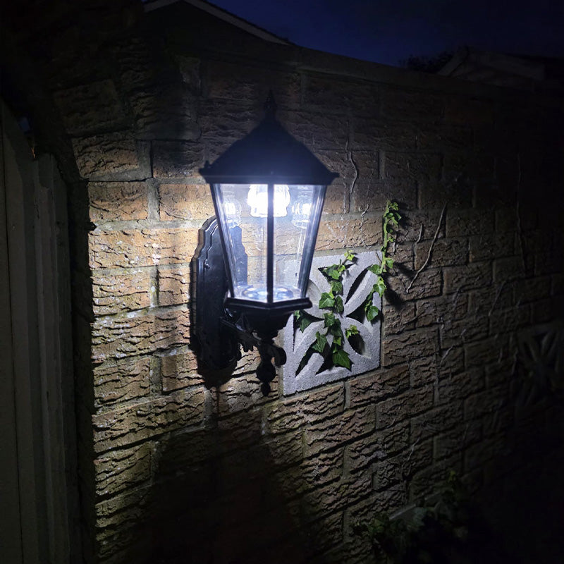 Bramwick solar wall lantern illuminated at night