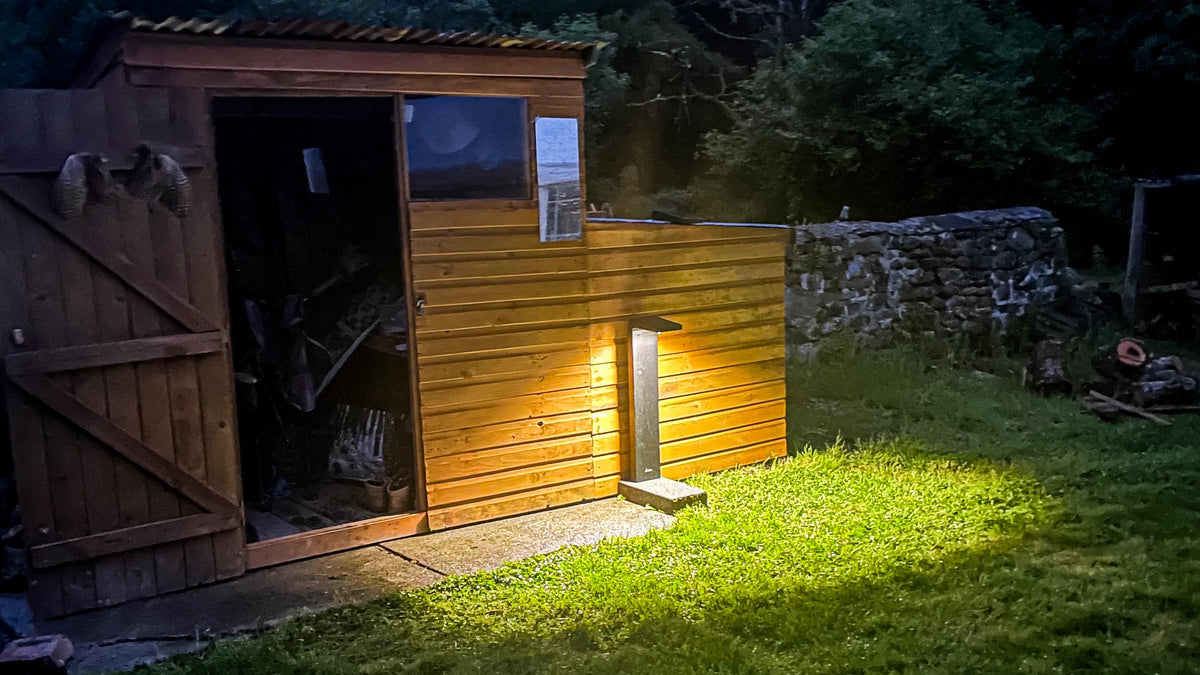 Cresta solar bollard illuminating a shed and surrounding area