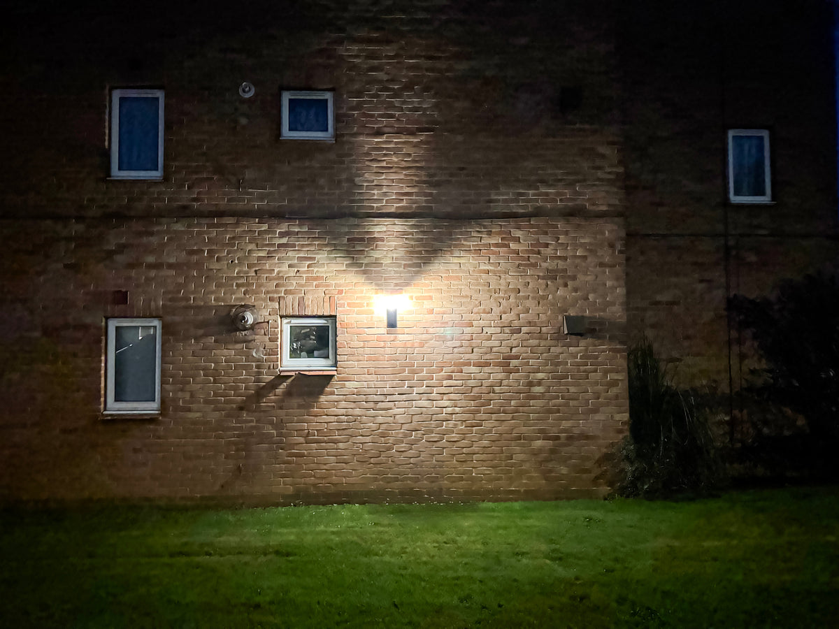 Olympia Pro solar wall light installed and illuminated