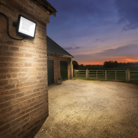 Rural Secure YardGuard 50W LED Security Floodlight illuminating a farmyard